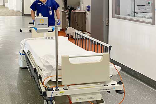 Electrodrive's GZ30 moving a hospital bed through corridors