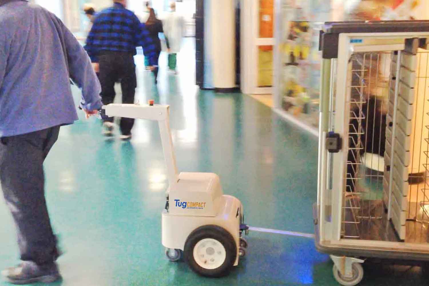 The Tug Compact towing a meal delivery trolley in a hospital
