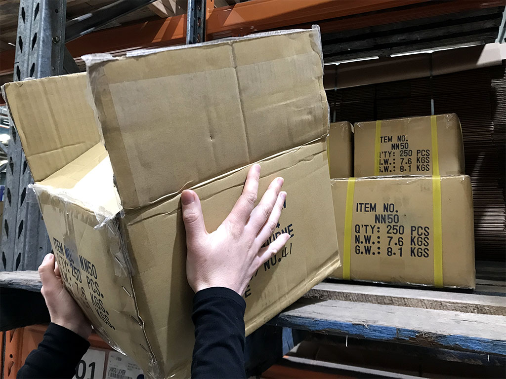 Pulling heavy boxes off a shelf